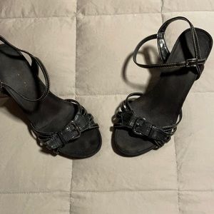 Pretty in black 3 in platform sandals. Gently worn